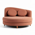 Sofa o owalnym kształcie z poduszkami w kolorze brzoskwiniowym 85 x 120 x 70cm